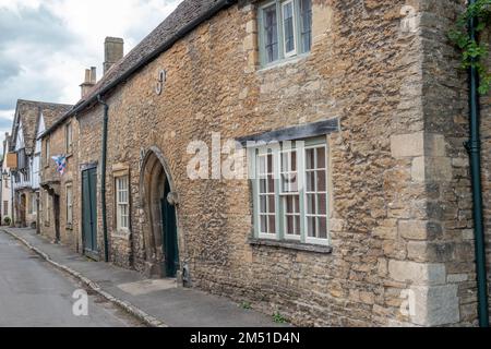 honey coloured Cotswold stone houses in Lacock The Cotswolds England Stock Photo