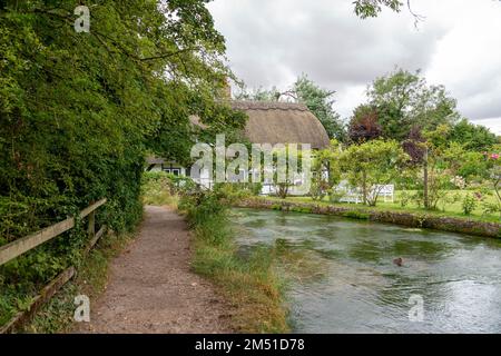 The Fulling Mill across the River Alre in Alresford Hampshire England Stock Photo