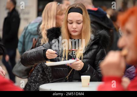 The preparation of black risotto in a large Pula padel was held at the Pula Green Market. Under the chef's baton of Budimir Zizovic, about 400 portions were prepared and distributed to citizens, in Pula, Croatia, on  December 24, 2022.  Photo: Sasa Miljevic/PIXSELL Credit: Pixsell/Alamy Live News Stock Photo