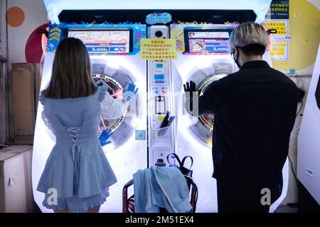 People playing Maimai DX Universe Plus together at GameZone in Mong Kok on December 4, 2022 Stock Photo