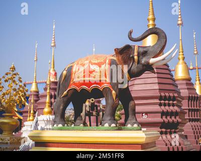 An elephant wearing an ancient uniform at temple called 'Wat Pipat Mongkol' or 'The golden buddha's Building', Thungsaliam, Sukhothai, Thailand in 26 Stock Photo