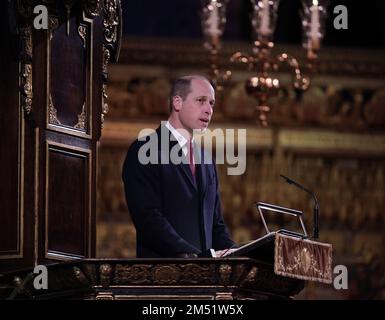 The Prince of Wales, reading an extract from Queen Elizabeth II’s Christmas Message 2012, during the 'Together at Christmas' Carol Service at Westminster Abbey in London. Picture date: Thursday December 15, 2022. Stock Photo