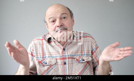 Emotional senior man not sure for something. Stock Photo