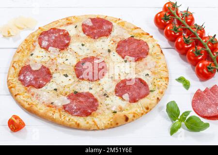 Salami pizza ingredients on wooden board wood Stock Photo