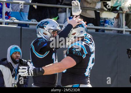 Charlotte, NC, USA. 24th Dec, 2022. Carolina Panthers quarterback Sam Darnold (14) celebrates with guard Austin Corbett (63) after his touchdown during the first half of the NFL matchup against the Detroit Lions in Charlotte, NC. (Scott Kinser/Cal Sport Media). Credit: csm/Alamy Live News Stock Photo