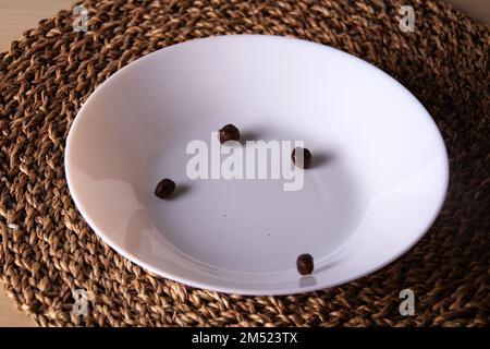 photo several cereal balls lies in a deep white plate Stock Photo