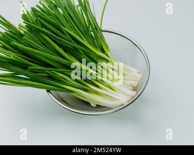 bunch of fresh chives on the table Stock Photo