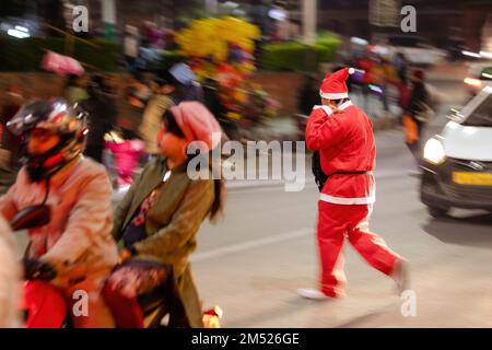 Lalitpur, Nepal. 24th Dec, 2022. A man dressed as Santa Claus seen during Christmas Eve at the Lalitpur shopping center. Christmas Eve is the evening or entire day before Christmas Day, the festival commemorating the birth of Jesus Christ. Christmas Day is observed all-around the world. (Photo by Prabin Ranabhat/SOPA Images/Sipa USA) Credit: Sipa USA/Alamy Live News Stock Photo