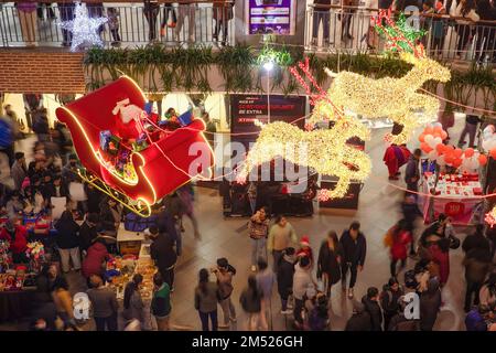 Lalitpur, Nepal. 24th Dec, 2022. People admire Christmas lights and decorations during Christmas eve at the shopping mall in Lalitpur. Christmas Eve is the evening or entire day before Christmas Day, the festival commemorating the birth of Jesus Christ. Christmas Day is observed all-around the world. (Photo by Prabin Ranabhat/SOPA Images/Sipa USA) Credit: Sipa USA/Alamy Live News Stock Photo