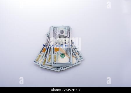 American 100 dollar banknote bundles placed on white background Stock Photo