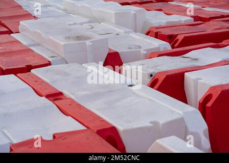 Road barriers for fencing place of repair of highway and preventing passage of cars into danger zone Stock Photo