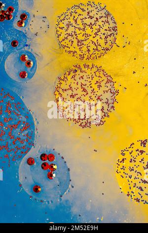 Oil bubbles inside water base form patterns Stock Photo