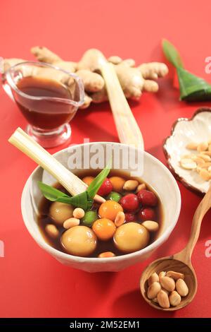 Tang Yuan or Wedang Ronde Jahe is Glutinous Rice Balls with Ginger and Palm Sugar Syrup. Popular as Tangyuan in Chinese Culture, Eat at Dongzhi Festiv Stock Photo