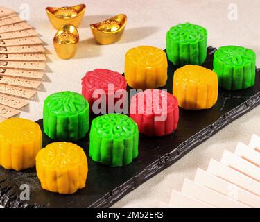 Colorful Snow Skin Moon Cake, Sweet Mochi Mooncake, Traditional Chinese Dessert for Mid Autumn Festival. Stock Photo