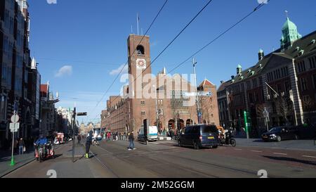 A street view of the Beurs van Berlage in downtown Amsterdam, with people enjoying the sunny day Stock Photo