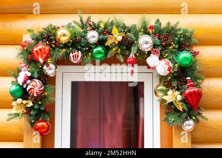 Christmas decoration above door with wood background Stock Photo