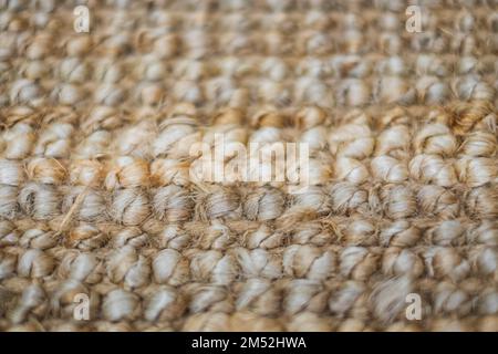Natural linen texture for the background. Handmade rug made of jute. Jute knitted fabric. Nobody, blurred, selective focus Stock Photo