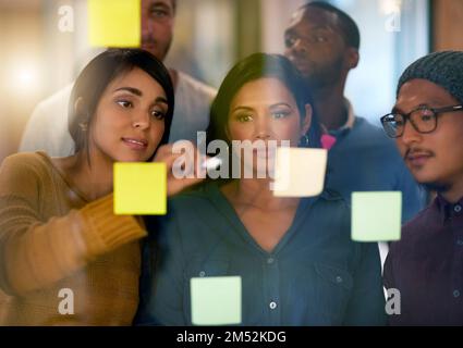 Planning makes our job easier. a team of entrepreneurs collaborating in a modern office. Stock Photo
