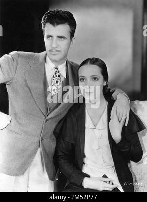 Newlyweds MGM's Supervising Art Director CEDRIC GIBBONS and his actress wife DOLORES DEL RIO 1930 Portrait publicity for Metro Goldwyn Mayer Stock Photo
