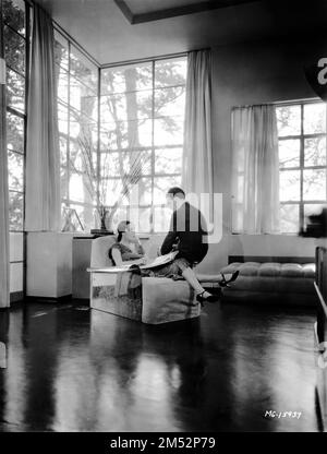 MGM's Supervising Art Director CEDRIC GIBBONS and his actress wife DOLORES DEL RIO in 1931in their Modernist / Art Deco Mailbu Beach Home designed by Gibbons Photo by CLARENCE SINCLAIR BULL publicity for Metro Goldwyn Mayer Stock Photo