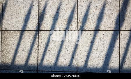 shadows from the railing on floor marble tile. background Stock Photo