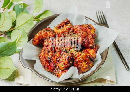 yangnyeom chicken, Korean style Seasoned Fried Chicken : This dish is seasoned chicken cut into pieces, deep- fried, and mixed with soy sauce, gochuja Stock Photo