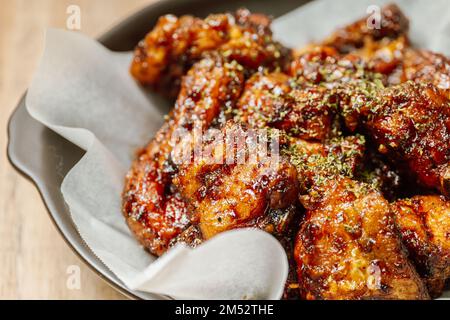 yangnyeom chicken, Korean style Seasoned Fried Chicken : This dish is seasoned chicken cut into pieces, deep- fried, and mixed with soy sauce, gochuja Stock Photo