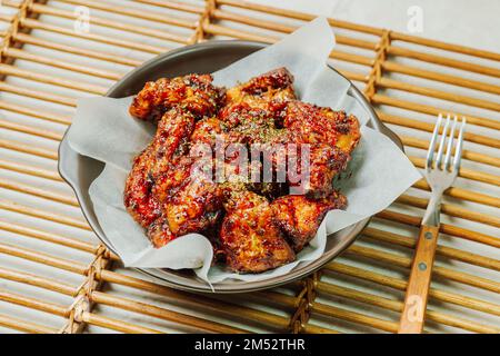 yangnyeom chicken, Korean style Seasoned Fried Chicken : This dish is seasoned chicken cut into pieces, deep- fried, and mixed with soy sauce, gochuja Stock Photo