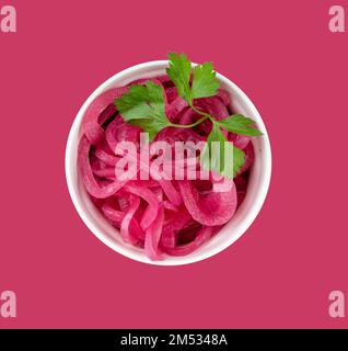 Top view of red or magenta onion slices in ring shape and stack is ...