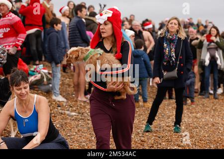 25th December 2022. Brighton Beach, City of Brighton & Hove, East Sussex, UK. The annual Christmas Day Swim where locals arrive on Brighton beach for a quick dip in the English Channel with the support of local life guards in assistance. David Smith/Alamy live news Stock Photo