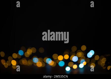 multi-colored lights on a black background. Christmas, New Year's background Stock Photo