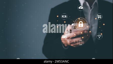 Cyber security concept, data protection and secured internet access, man using smartphone and laptop with icon graphic Cyber security network of conne Stock Photo