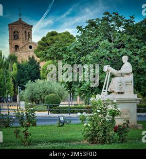 A vertical shot of La Encajera sculpture surrounded by green vegetation. Almagro, Ciudad Real, Spain. Stock Photo