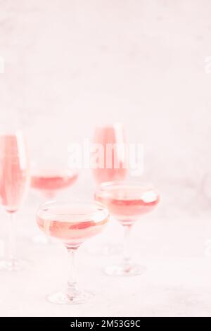 Champagne or wine in glasses on light background. Copy space. Stock Photo