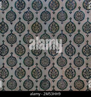 The texture of the ceramic tiles in the oriental style. Turkish ceramic tiles lined up on the wall. Stock Photo