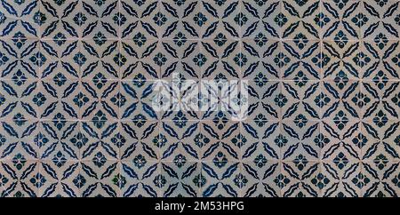 The texture of the ceramic tiles in the oriental style. Turkish ceramic tiles lined up on the wall. Stock Photo