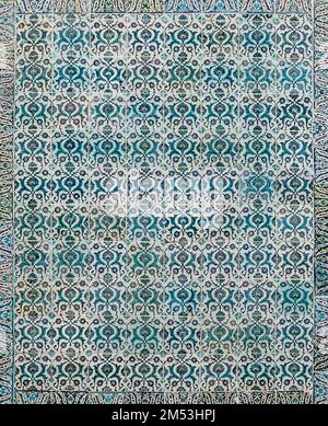 The texture of the ceramic tiles in the oriental style. Turkish ceramic tiles lined up on the wall. Stock Photo