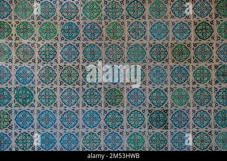 The texture of the ceramic tiles in the oriental style. Turkish ceramic tiles lined up on the wall. Stock Photo
