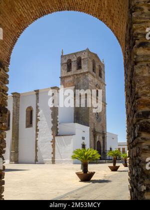 Iglesia de Santa Maria del Castillo seen through the city wall of Olivenza Stock Photo