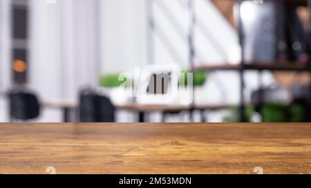Blurred office background, work space interior with focused wood desk, wooden table. High quality photo Stock Photo
