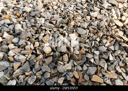 Quantity of crushed stone isolated over the stone background Stock Photo