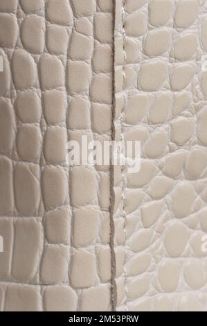 Stitches on white leather texture macro close up view Stock Photo