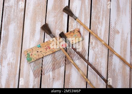 Paint brushes on technique ebru art on wooden background Stock Photo