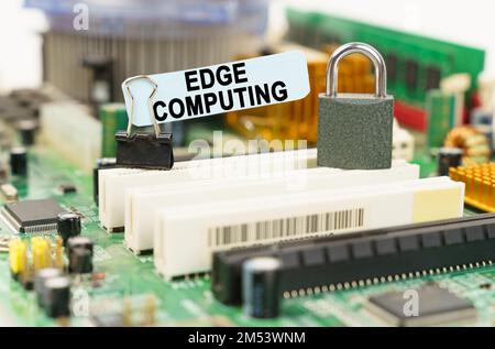 Computer security concept. There is a sticker on the motherboard that says - Edge Computing Stock Photo