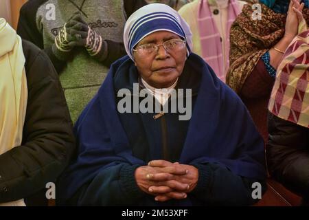 Srinagar, India. 25th Dec, 2022. A Christian devotee prays inside the ...