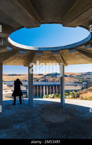 Visitor photographing Grand Coulee hydroelectric dam; largest producer of power in the USA; Columbia River; Washington state; USA Stock Photo