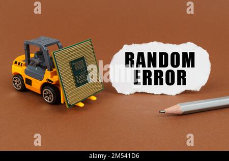 Technological concept. On a brown surface, a forklift is transporting a processor, next to it is paper with the inscription - RANDOM ERROR Stock Photo