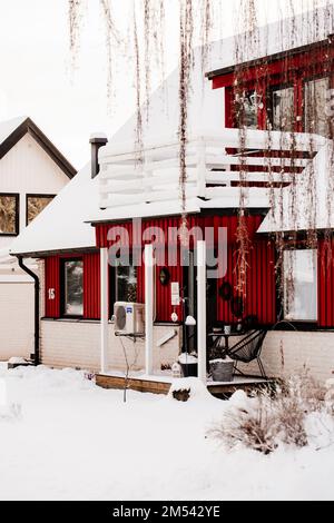 https://l450v.alamy.com/450v/2m542ye/kyrksten-varmland-sweden-12-15-2022-winter-in-swedish-village-red-houses-2m542ye.jpg