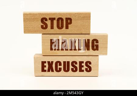 Business concept. On a white surface are wooden blocks with the inscription - Stop Making Excuses Stock Photo