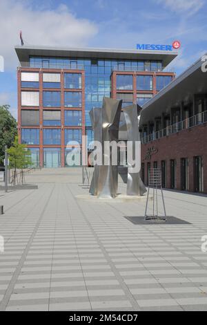 Sculpture Three Graces by Ewerdt Hilgemann 2011, modern, abstract, Messer Square, Adolf Messer Forum, Bad Soden, Taunus, Hesse, Germany Stock Photo
